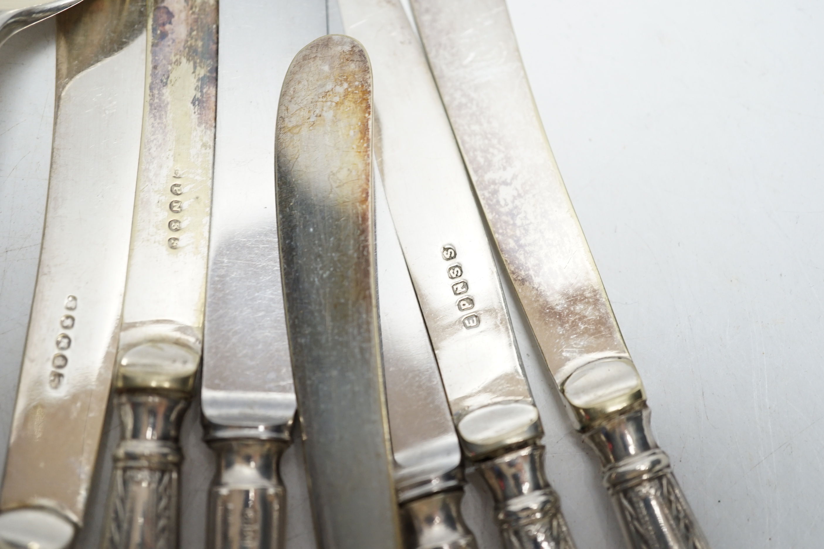 A set of six George V silver Old English pattern soup spoons, by James Dixon & Sons, a set of six silver handled tea knives and a pair of silver sugar tongs.